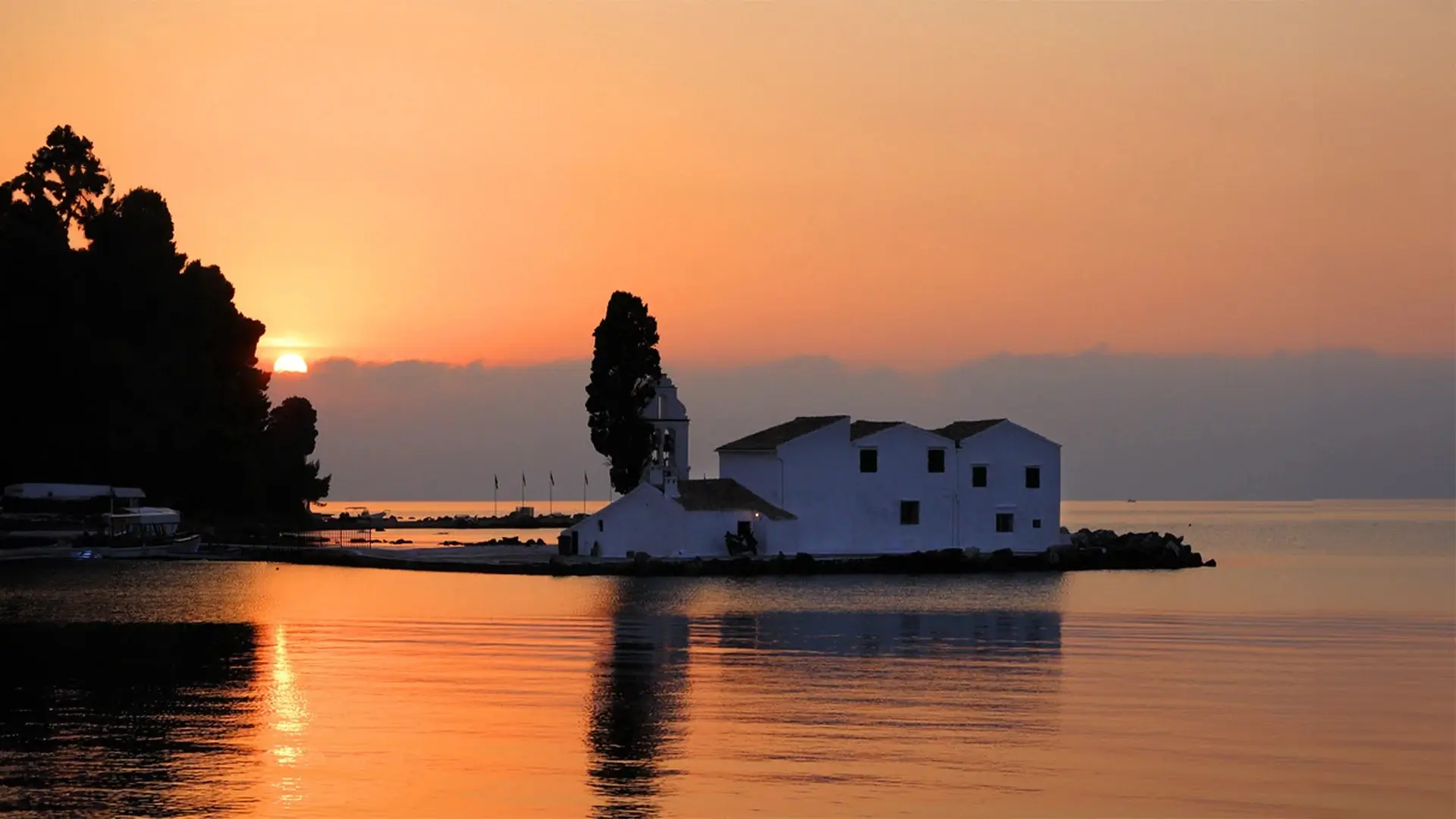 Warm sunset over the sea near Kommeno, Corfu